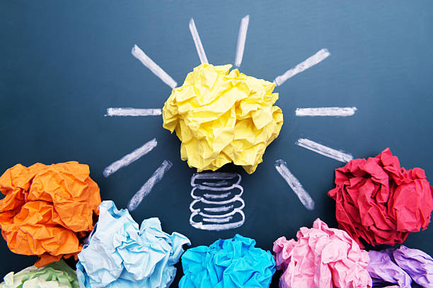 istock Paper Ball on Blackboard and Lightbulb Shape 604005598