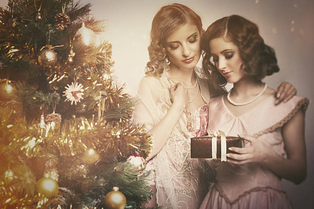 istock young women with christmas present 604007714