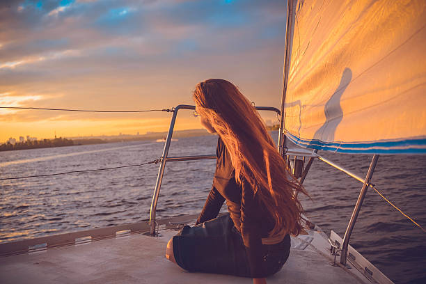 istock Girl on the ship looking bank 604008654