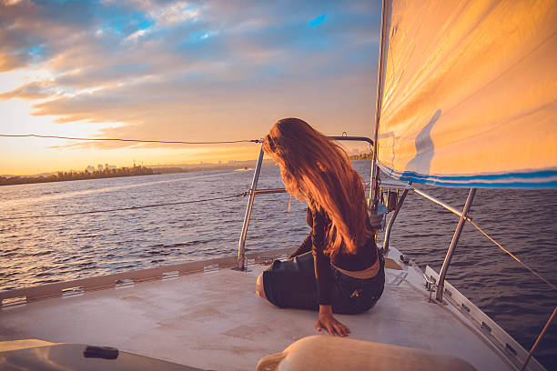 istock Girl on the ship looking bank 604008694