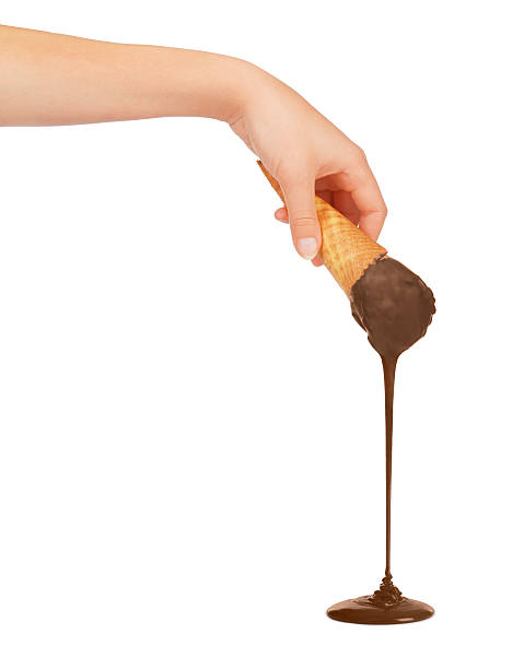 istock hands holding waffle cookies poured chocolate 604010062