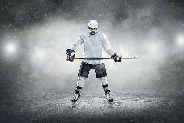 istock Ice hockey player on the ice, outdoors 604012406