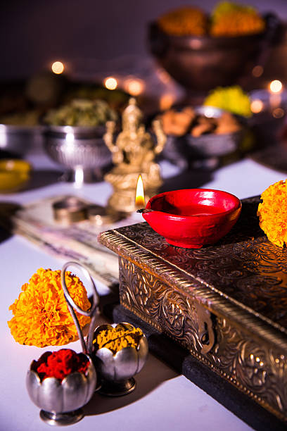 istock typical diwali celebration or puja in india with diya 604014114