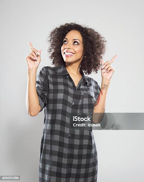 Beautiful Afro American Woman Pointing At Copy Space Stock Photo - Download Image Now
