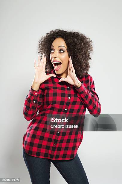 Excited Afro American Young Woman Shouting Stock Photo - Download Image Now - Adult, Adults Only, African Ethnicity
