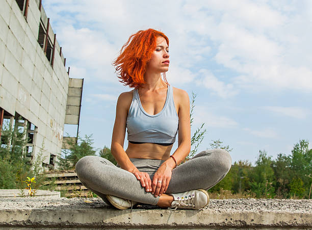istock Beautiful girl sitting on edge 604014740