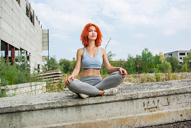 istock Beautiful girl sitting on edge 604014900