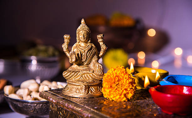 istock typical diwali celebration or puja in india with diya 604015132