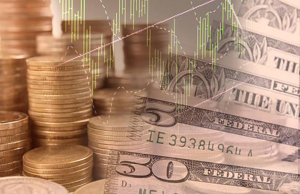 istock pile coin money with dollar bills 604015512