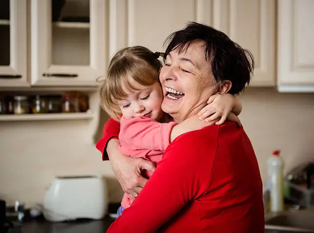 Photo of Big hug - grandmother with granddaughter