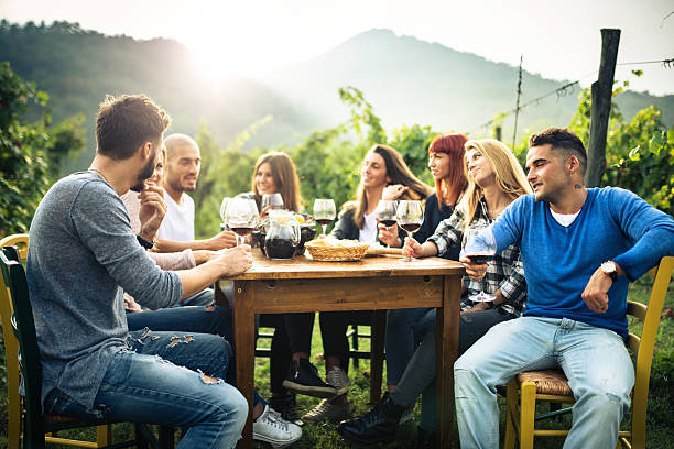 istock friends toasting with red wine after the harvesting 604016400