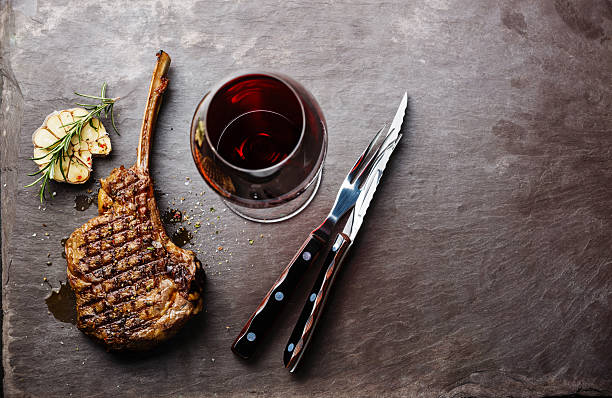 istock Grilled beef Veal rib and wine 604017796
