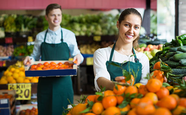 istock Stuff in apron selling sweet oranges, lemons and tangerines 604018476
