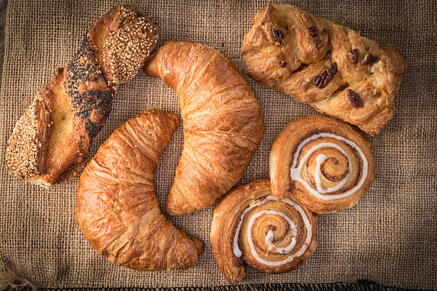 istock fresh bread  and wheat on the wooden 604019252