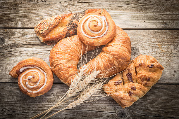 istock fresh bread  and wheat on the wooden 604019752