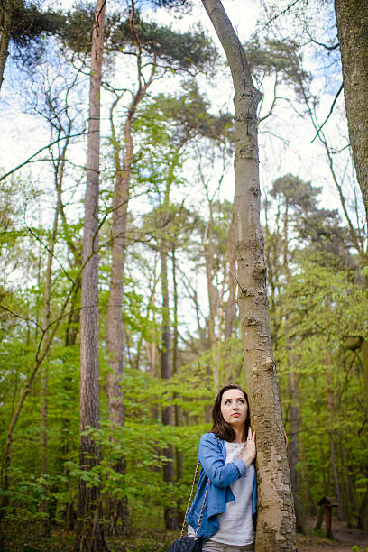 istock Young girl on a walk in the forest 604022326