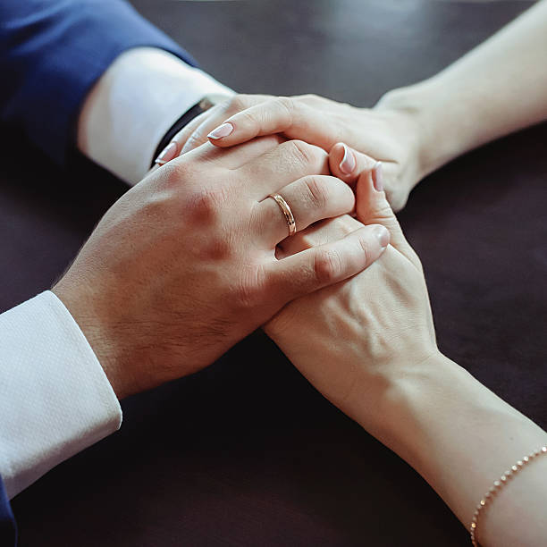 istock Lovers couple holding hands 604025110