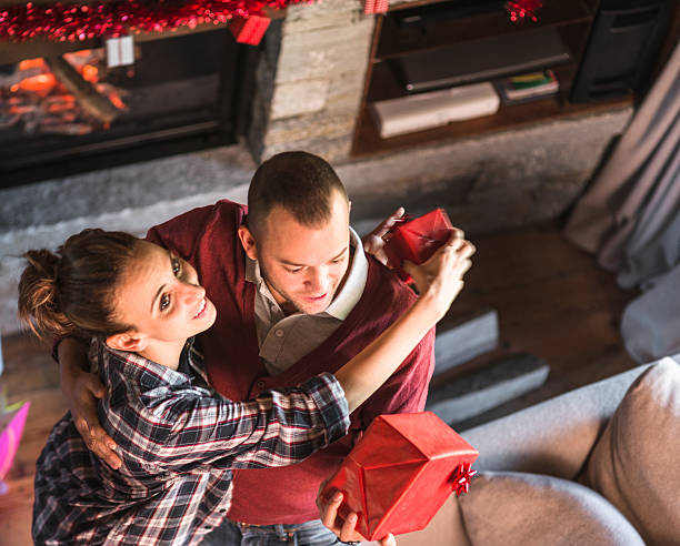 istock giving the present to the girlfriend for christmas 604026988