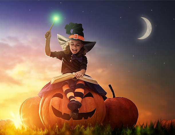 istock little witch outdoors 604027104