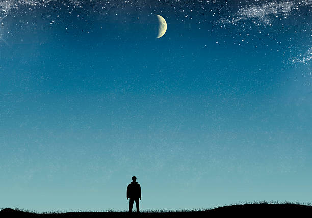 istock Silhouette of man with starry sky and moon 604027940