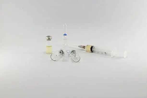 medical syringes with medicine and ampule of medicine