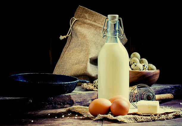 Organic farm products, ingredients for omelets or baking. Vintage wooden background, rustic style. Low key, selective focus