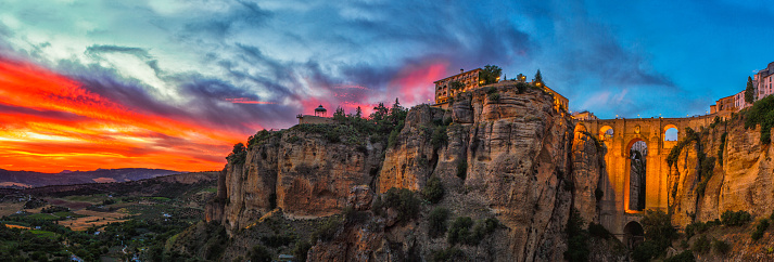 Low angle view of buildings on cliffs at city of Ronda during a sunset, Malaga Province, Andalusia, Spain