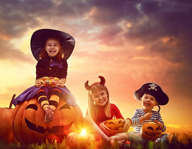istock children and pumpkins on Halloween 604030854