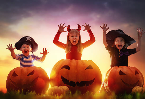 istock children and pumpkins on Halloween 604030934