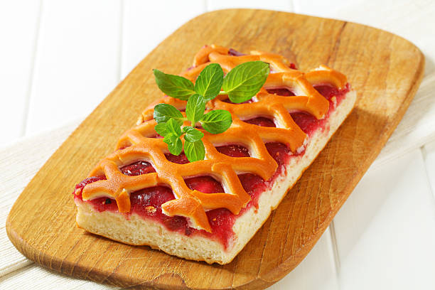Jam tart with a lattice top crust Jam tart with a lattice top crust crostata photos stock pictures, royalty-free photos & images