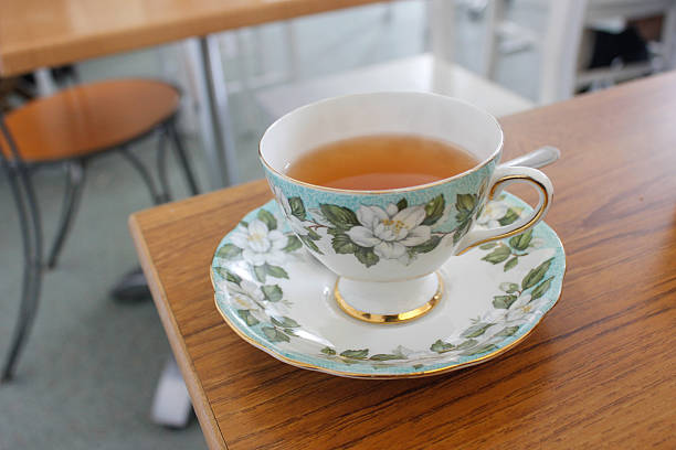 Hot tea in floral porcelain cup