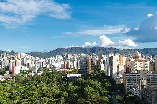Air panoramic view of Belo Horizonte city, capital of Minas Gerais state, Brazil,with Afonso Pena Avenue, City Park and buildings of the city center in the foreground and the Serra do Curral in the background.