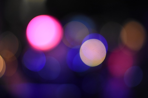 Blurred twilight bokeh lights city office building, abstract background