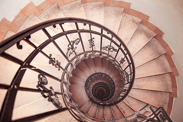 istock spiral staircase in an old house 604334570