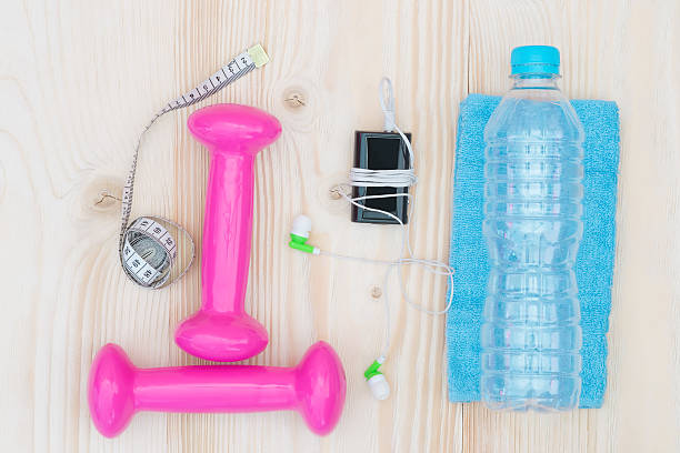 istock things on the table sports and pink dumbbell 604335472