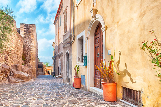 the beautiful alley of castelsardo old city the beautiful alley of castelsardo old city - sardinia - italy castelsardo photos stock pictures, royalty-free photos & images
