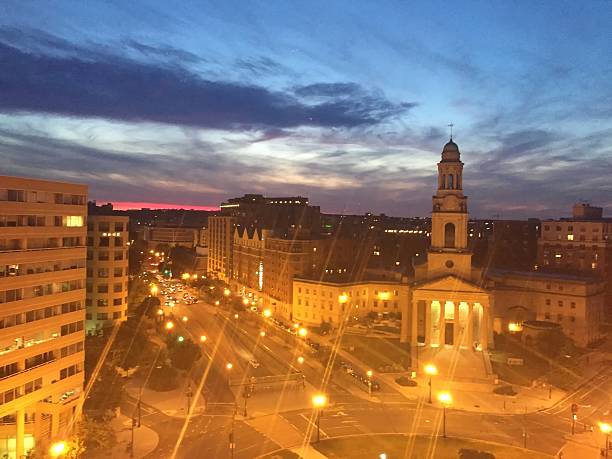 istock city lights and sunset 604336456