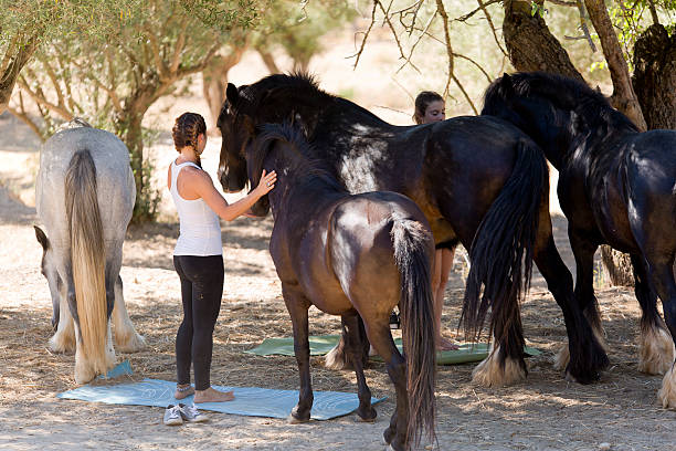 istock Girls with horses 604336798