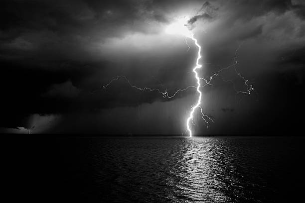 Photo of double lightening hitting the rio plata, in black and white.