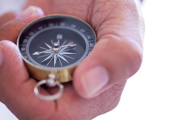 istock Close Up Of Man Holding Compass 604337950