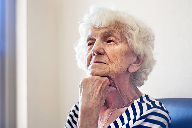 istock Elderly Woman Waiting at the Doctors Office 604338384
