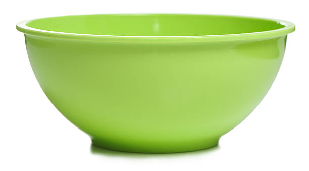 Green mixing bowl on white stock photo