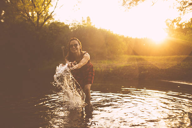 istock Girl playing in the water 604339812