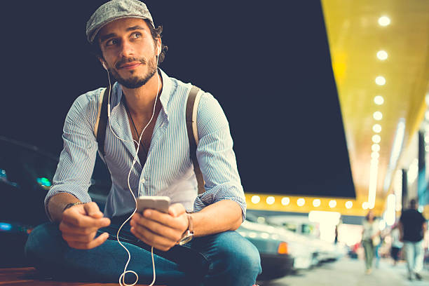 istock Handsome man listening music 604340616