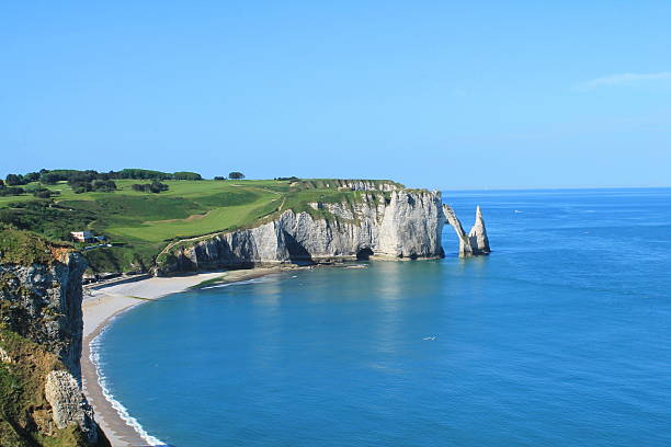 istock Beach and cliffs of etretat, France 604342696