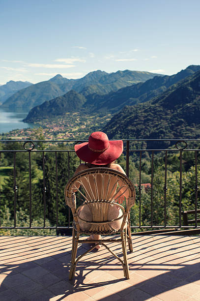 istock woman on a chair on the balcony 604343310