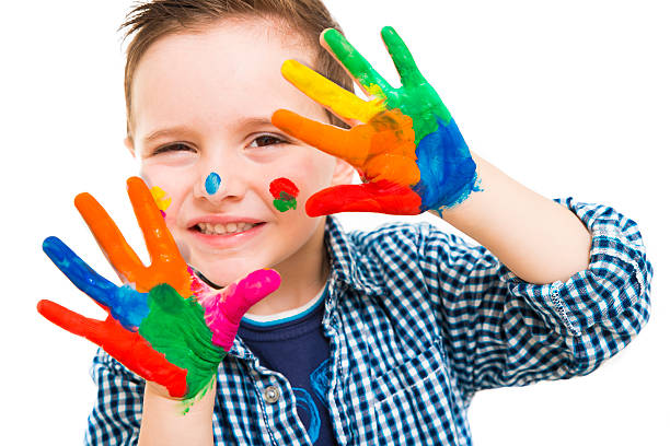 istock happy child with their hands all painted playing 604344018