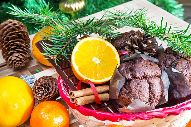 istock Christmas still life. Close up maffins, oranges and chocolate 604344080