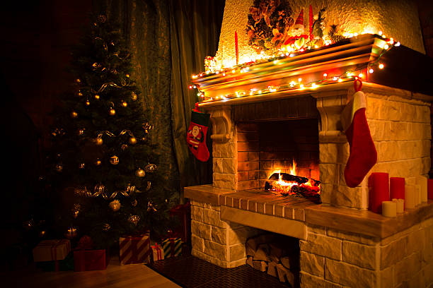 istock christmas interior with xmas tree, presents and fireplace 604345220