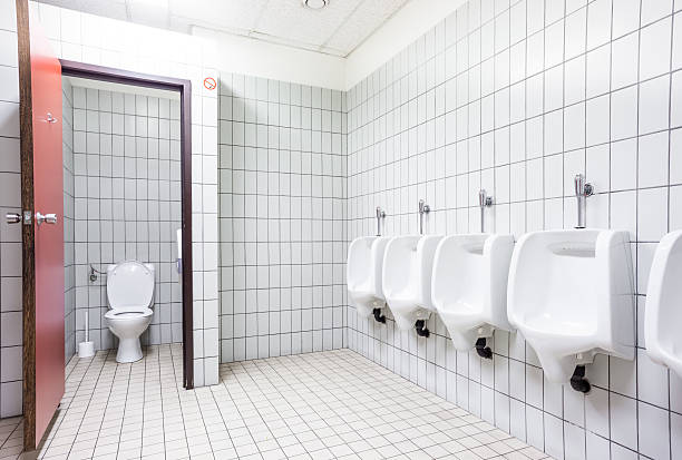 istock urinal and toilet doors 604350682